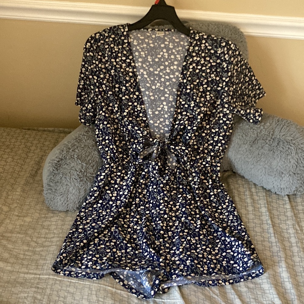 Dark blue V neck front tie romper with flowers